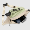 green sling bag with water bottle holder